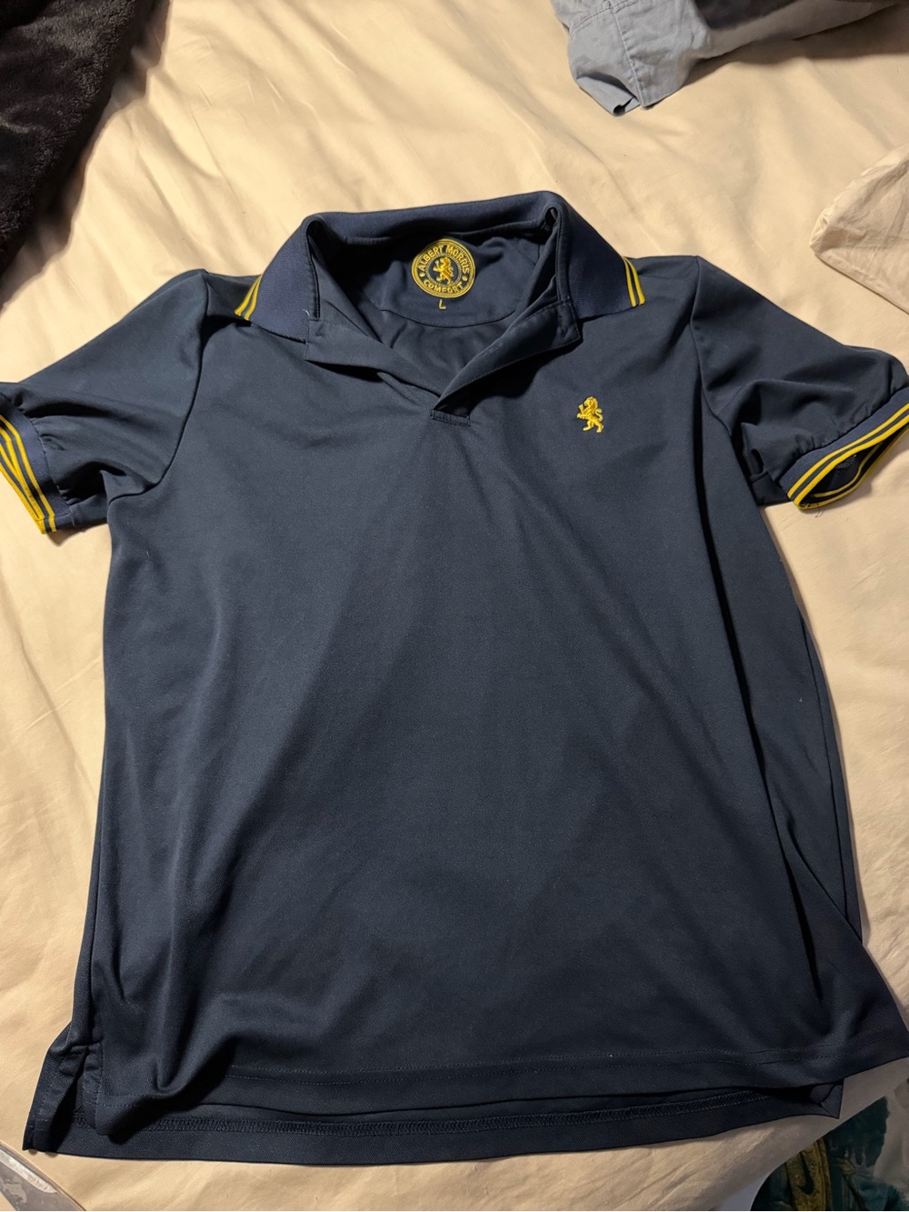 Albert Nipon Navy Polo with Yellow Trim and Crest Logo